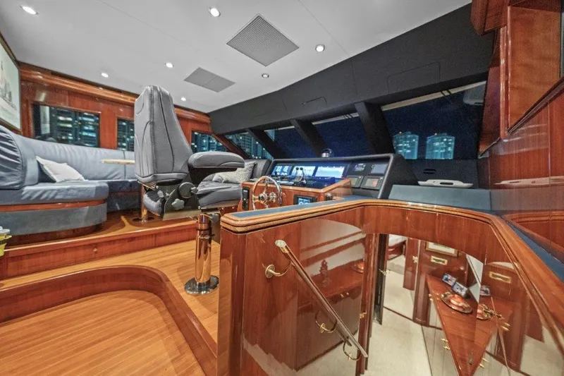 Slide: The Image of Luxurious 2006 Cheoy Lee motor yacht helm with polished wood and modern controls. - 17