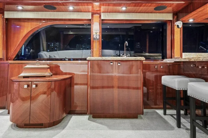 Slide: The Image of Luxurious 2006 Cheoy Lee Motor Yacht interior with polished wood cabinetry and modern fixtures. - 25
