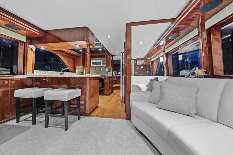 Slide: The Image of Luxurious 2006 Cheoy Lee Motor Yacht interior with elegant wood finishes and modern furnishings. - 26