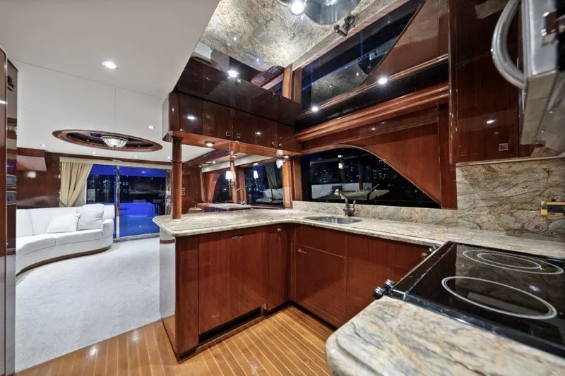 Slide: The Image of Luxurious 2006 Cheoy Lee Motor Yacht interior with elegant kitchen and spacious living area. - 27