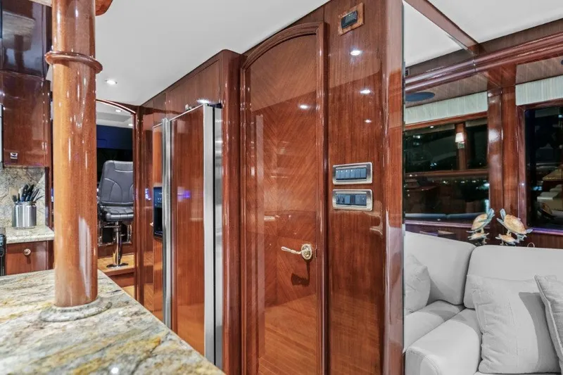 Slide: The Image of Luxurious 2006 Cheoy Lee motor yacht interior with polished wood and modern amenities. - 28