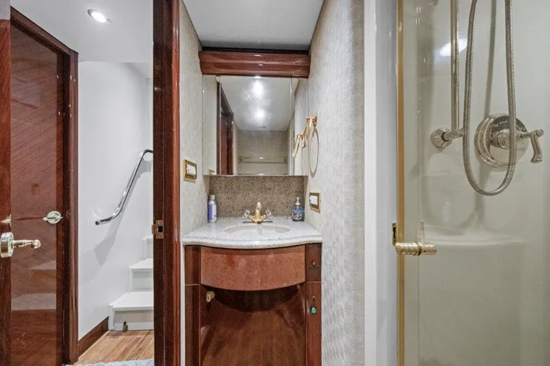 Slide: The Image of Luxurious bathroom on a 2006 Cheoy Lee Motor Yacht with elegant wood finishes and modern fixtures. - 33