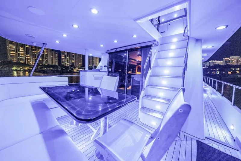 Slide: The Image of Luxurious 2006 Cheoy Lee Motor Yacht with elegant deck lighting and modern seating area. - 41