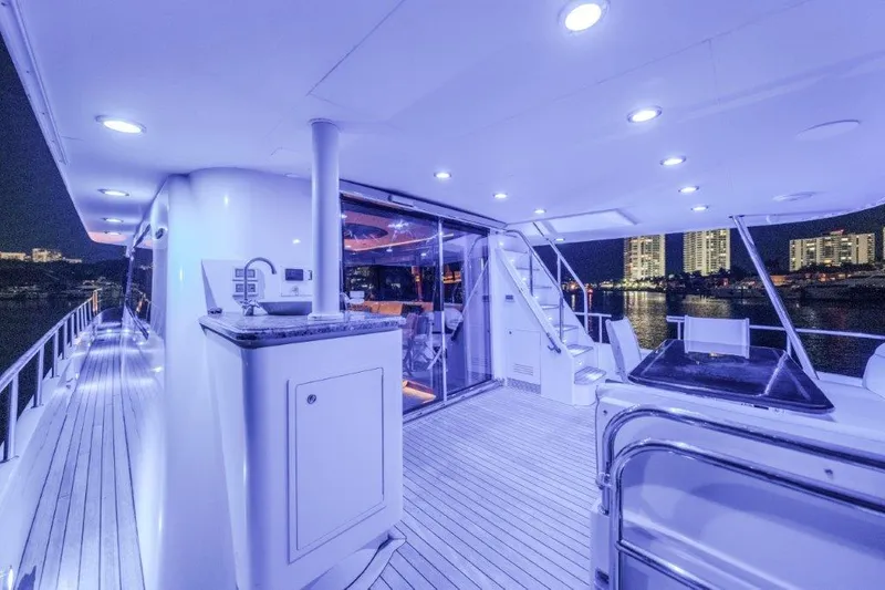 Slide: The Image of Luxurious 2006 Cheoy Lee motor yacht deck with modern lighting and city skyline view. - 45