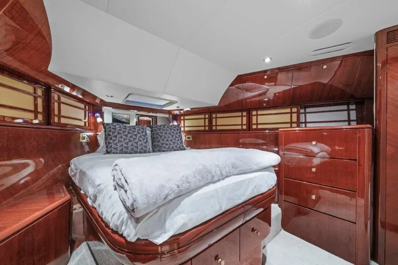 Slide: The Image of Luxurious 2006 Cheoy Lee Motor Yacht bedroom with elegant wood finish and plush bedding. - 5