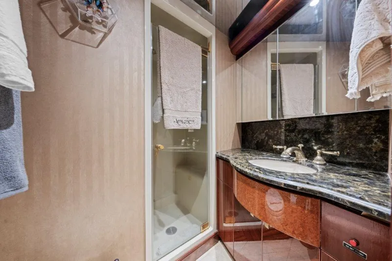 Slide: The Image of Luxurious bathroom in 2006 Cheoy Lee Motor Yacht with granite countertop and glass shower. - 7