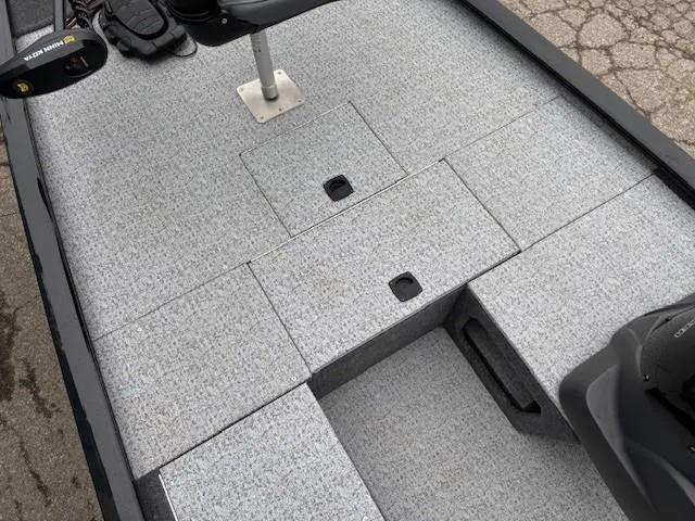 Slide: The Image of 2024 Tracker Pro 170 boat deck with storage compartments and seating area. - 11