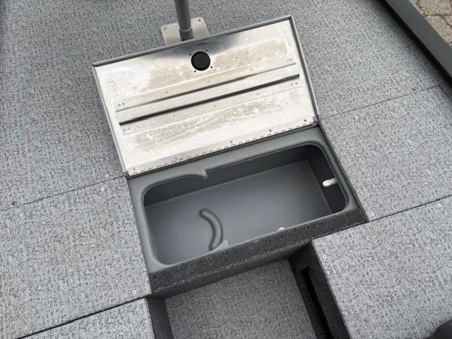Slide: The Image of 2024 Tracker Pro 170 boat storage compartment with open lid, showcasing interior space. - 12
