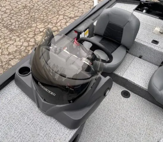 Slide: The Image of 2024 Tracker Pro 170 boat interior with steering console and seating. - 17