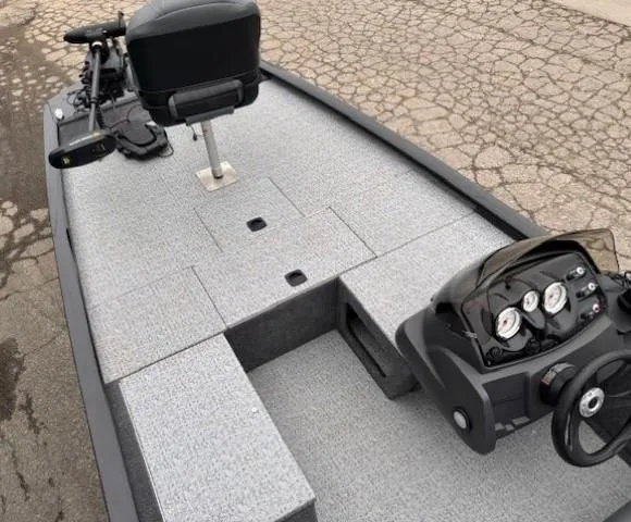 Slide: The Image of 2024 Tracker Pro 170 boat interior with steering console and seating. - 7