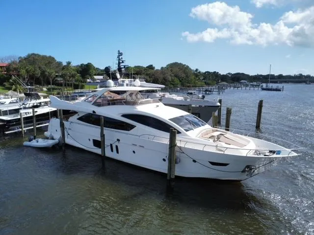 Slide: The Image of Luxury 2009 Astondoa 96 GLX yacht docked at a scenic marina. - 1