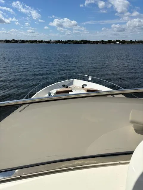 Slide: The Image of Astondoa 96 GLX yacht cruising on a calm lake under a blue sky, 2009 model. - 13