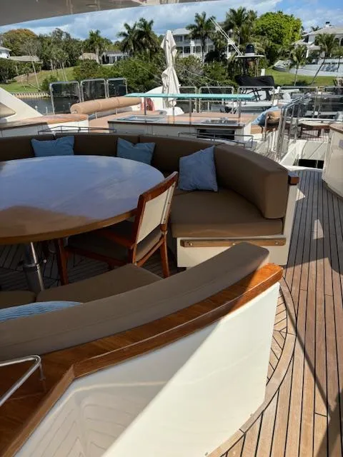 Slide: The Image of 2009 Astondoa 96 GLX yacht deck with seating area and table. - 16