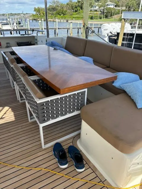 Slide: The Image of Astondoa 96 GLX 2009 yacht deck with seating, table, and shoes. - 20