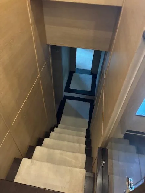 Slide: The Image of Staircase inside 2009 Astondoa 96 GLX yacht, featuring modern wooden design. - 32