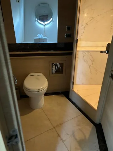 Slide: The Image of Bathroom interior of 2009 Astondoa 96 GLX yacht, featuring modern fixtures and marble accents. - 35