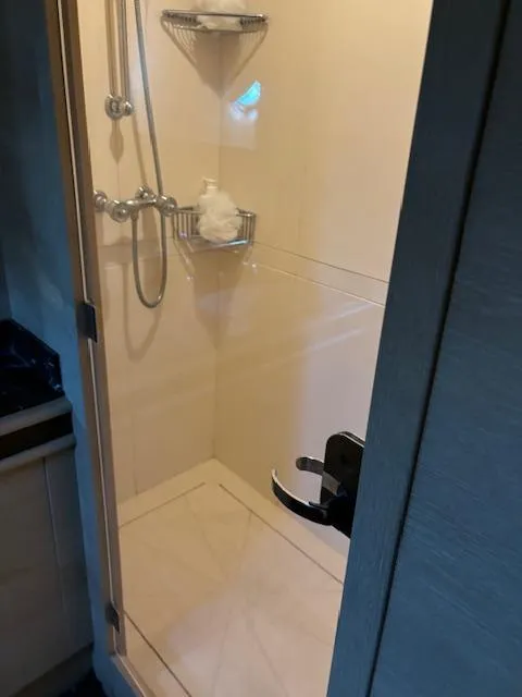 Slide: The Image of Shower area in 2009 Astondoa 96 GLX yacht, featuring modern fixtures and storage shelves. - 39