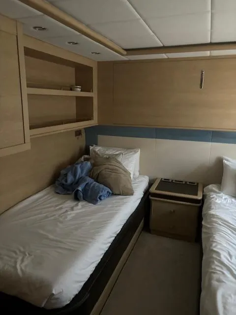 Slide: The Image of Interior cabin of 2009 Astondoa 96 GLX yacht with twin beds and wooden decor. - 40