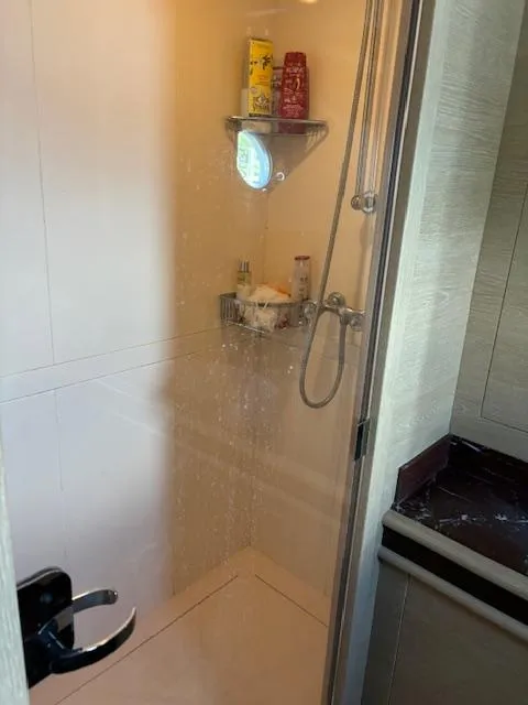 Slide: The Image of Shower area in 2009 Astondoa 96 GLX yacht, featuring modern fixtures and storage shelves. - 43