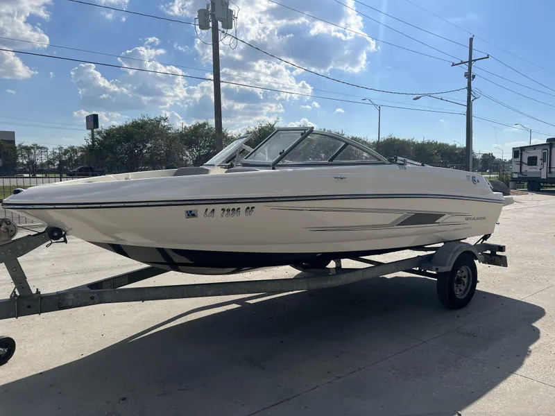 Slide: The Image of 2016 Bayliner 175 boat on trailer under a sunny sky. - 9
