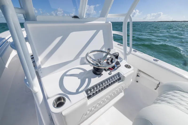 Slide: The Image of 2025 Invincible 36 Open Fisherman boat helm with ocean view. - 12