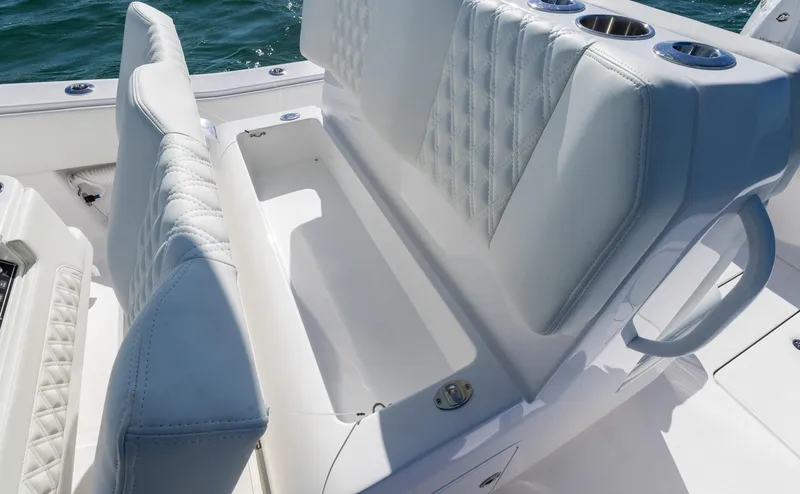 Slide: The Image of 2025 Invincible 36 Open Fisherman boat seating with storage compartment. - 15