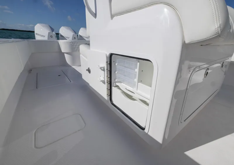 Slide: The Image of 2025 Invincible 36 Open Fisherman boat interior with storage compartments and outboard engines. - 16