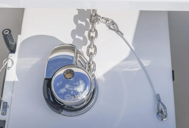 Slide: The Image of Anchor winch on 2025 Invincible 36 Open Fisherman boat, featuring a shiny metal finish. - 26