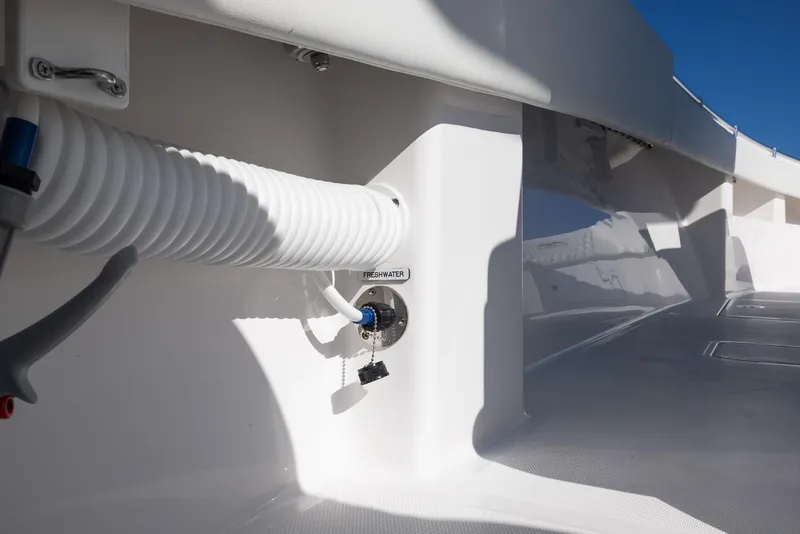 Slide: The Image of 2025 Invincible 36 Open Fisherman boat deck with hose attachment. - 30