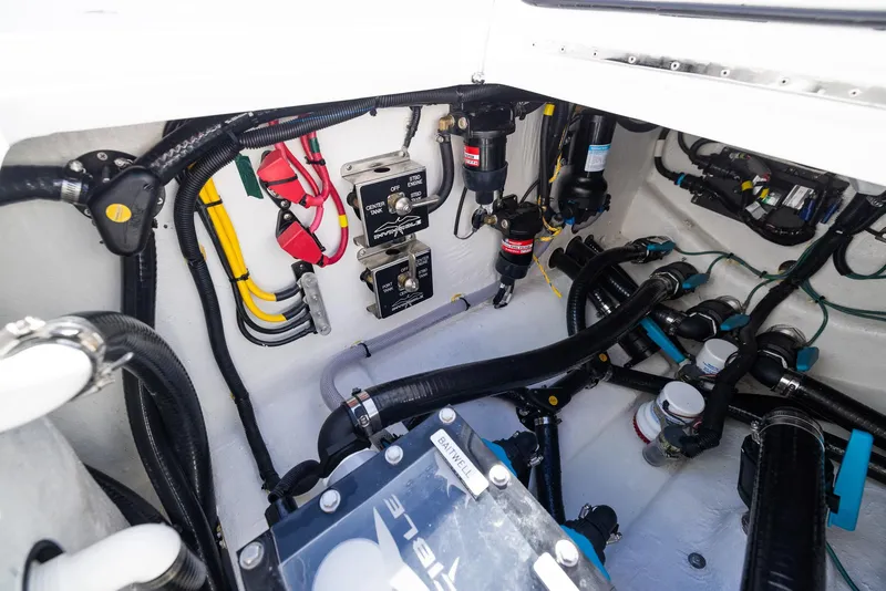 Slide: The Image of Engine compartment of 2025 Invincible 36 Open Fisherman, showcasing wiring and components. - 32