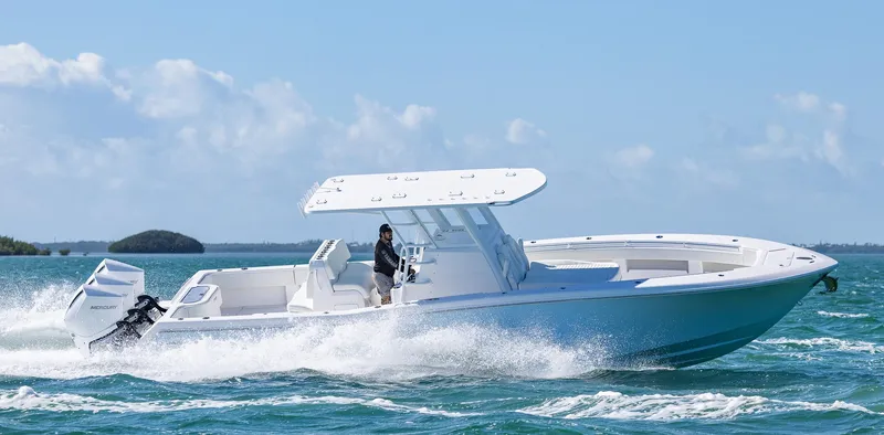 Slide: The Image of 2025 Invincible 36 Open Fisherman boat cruising on ocean waters. - 40
