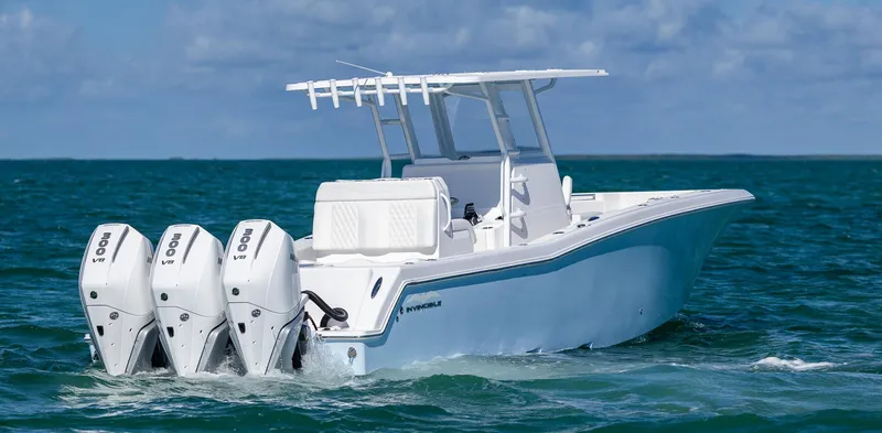 Slide: The Image of 2025 Invincible 36 Open Fisherman boat with triple engines on the ocean. - 6