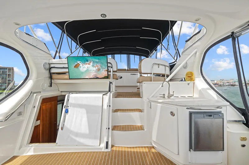 Slide: The Image of 2002 Silverton 43 Motor Yacht interior with modern amenities and sleek design. - 11