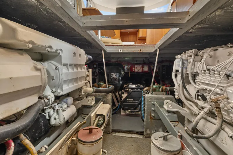 Slide: The Image of Engine room of a 2002 Silverton 43 Motor Yacht, showcasing mechanical components. - 31