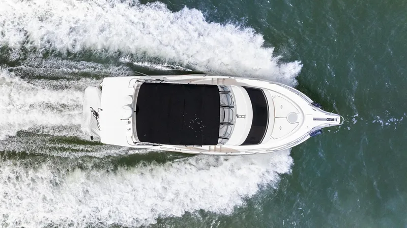 Slide: The Image of Aerial view of 2002 Silverton 43 Motor Yacht cruising on water. - 5