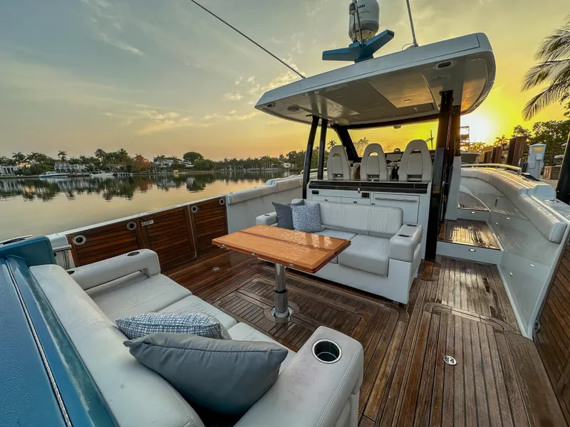 Slide: The Image of 2020 Ocean Alexander 45 Divergence Sport yacht with luxurious seating and sunset view. - 4