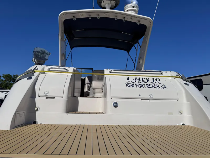 Slide: The Image of 1999 Regal 322 Commodore yacht docked, featuring spacious deck and canopy, Newport Beach, CA. - 14