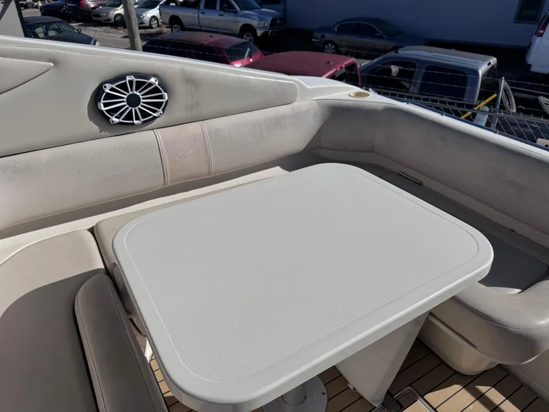 Slide: The Image of 1999 Regal 322 Commodore boat interior with seating and table. - 25