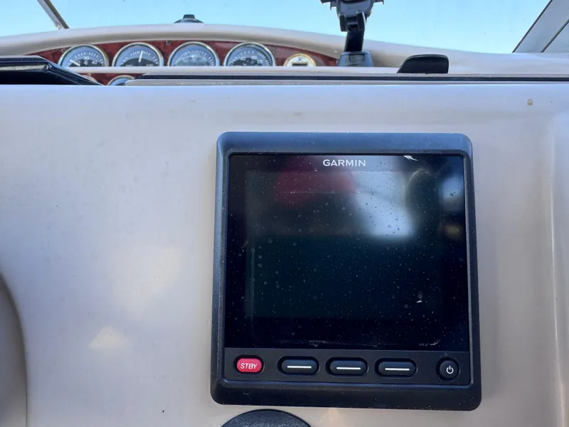 Slide: The Image of Dashboard of a 1999 Regal 322 Commodore with Garmin navigation system. - 42