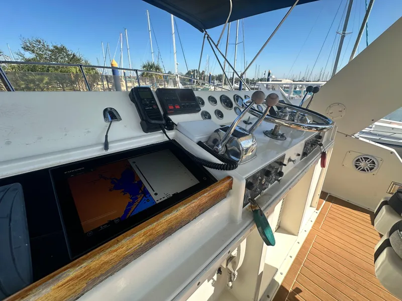 Slide: The Image of 1978 Hatteras 53 Motor Yacht helm with navigation equipment and controls. - 27