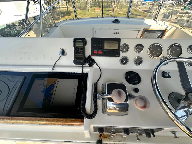 Slide: The Image of 1978 Hatteras 53 Motor Yacht helm with navigation equipment and controls. - 28