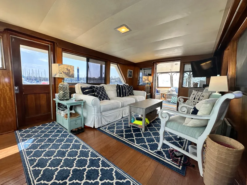 Slide: The Image of Interior of a 1978 Hatteras 53 Motor Yacht with elegant furnishings and nautical decor. - 34