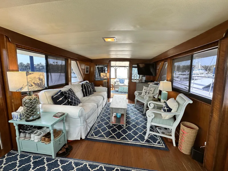 Slide: The Image of Interior of 1978 Hatteras 53 Motor Yacht with cozy seating and nautical decor. - 35
