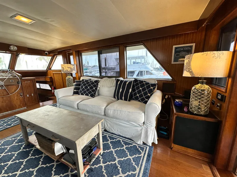 Slide: The Image of Interior of 1978 Hatteras 53 Motor Yacht with cozy seating and nautical decor. - 39