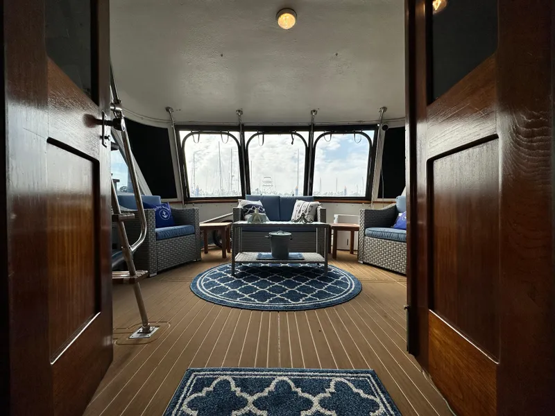 Slide: The Image of Interior of 1978 Hatteras 53 Motor Yacht with elegant seating and nautical decor. - 40