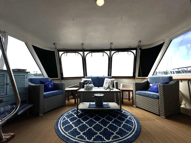 Slide: The Image of Interior of 1978 Hatteras 53 Motor Yacht with elegant seating and nautical decor. - 41