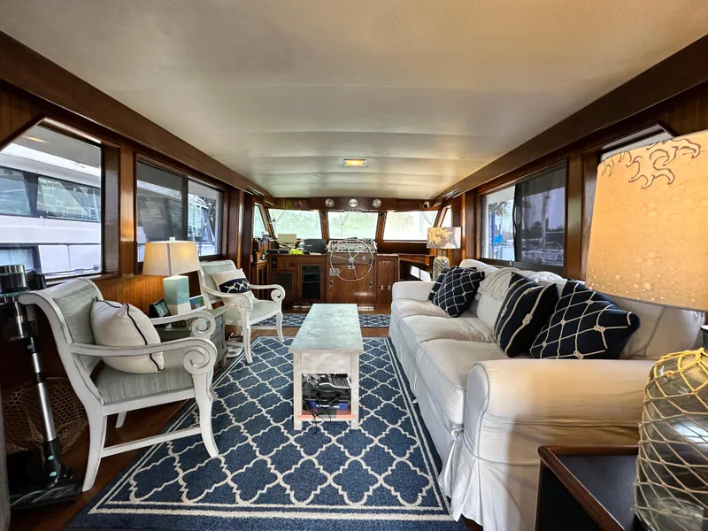 Slide: The Image of Interior of 1978 Hatteras 53 Motor Yacht with elegant seating and nautical decor. - 46