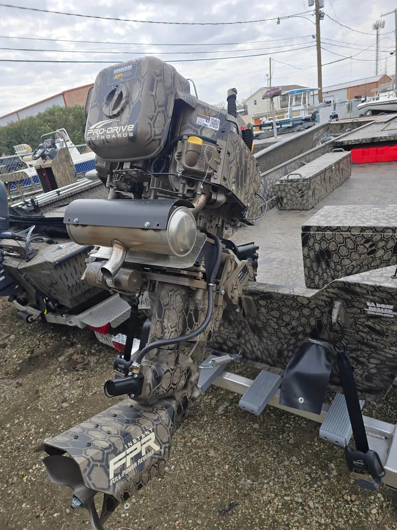 Slide: The Image of 2025 Pro-Drive 1848 SBX boat with camo design and powerful outboard motor. - 5