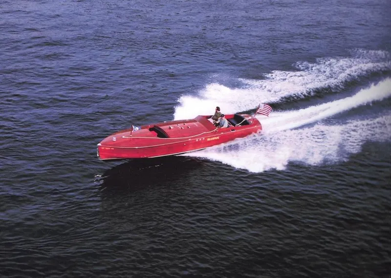 The Image of Red 2000 Classic Paul Dewhurst Gentleman's Racer speeding on water with American flag. - 0