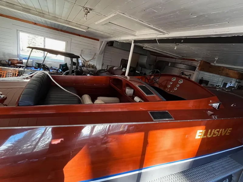 Slide: The Image of Classic 2000 Paul Dewhurst Gentleman's Racer boat in a garage, featuring sleek wooden design. - 8